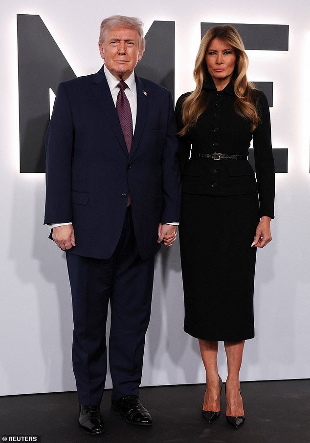 105951421-15511923-The_First_Lady_donned_a_buttoned_black_dress_and_stilettos_as_sh-m-2_1769753593133.jpg