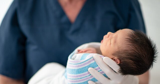 newborn-baby-held-by-nurse-hospital-stock-gettyimages-640x335.jpg