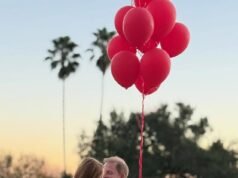Meghan condivide la foto di Harry raggiante che porta Lilibet tra le braccia mentre dice che loro e Archie sono i suoi “San Valentino per sempre”