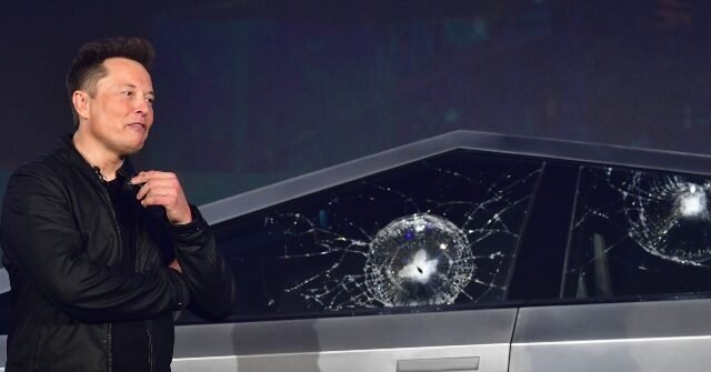 Elon-Musk-with-his-damaged-Tesla-Cybertruck-640x335.jpg