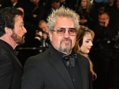 La star di Food Network Guy Fieri è inghiottita dalla teoria del complotto di Diners, Drive-Ins e Dives che cambia completamente lo spettacolo