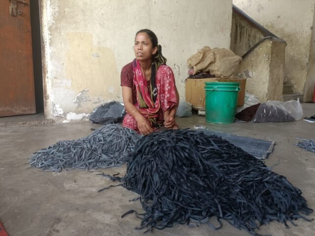 HBW-Shehnaz-Bano-works-on-a-leather-piece-outside-her-one-room-home-in-New-Delhi.-Scores-of-leather-strips-kept-infront-of-her-to-make-panels-for-a-leather-jacket.-1781975949.jpg
