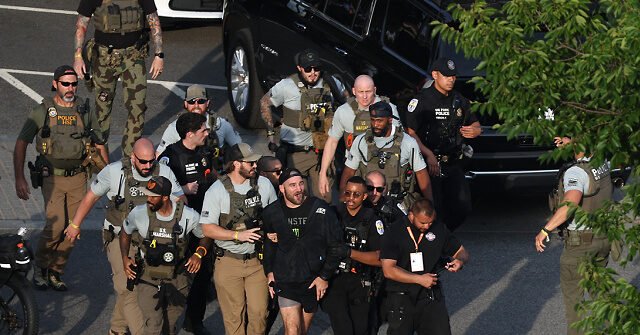 june14-26-Sean-Strickland-escorted-out-UFC-Freedom-250-ap-640x335.jpg