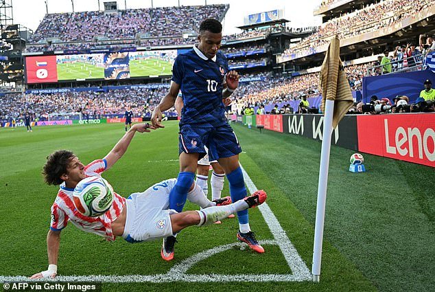 109801769-15953663-Matias_Galarza_left_is_seen_putting_in_a_nasty_challenge_on_Kyli-a-71_1783225284149.jpg
