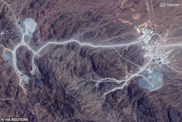 110176223-15995841-A_satellite_view_shows_tunnel_entrances_at_Pickaxe_Mountain_of_t-a-22_1784725262098.jpg