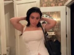 Charli XCX appare elegante con un corsetto bianco e un perizoma nero mentre celebra i fan che si scatenano per l’uscita del suo nuovo album