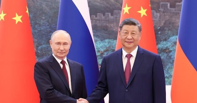 putin-xi-handshake-getty-640x335.jpg