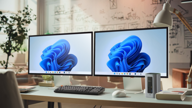 dual-monitor-computer-setup-with-a-keyboard-mouse-and-docking-station-on-a-desk.png