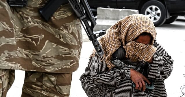 taliban-afghan-woman-crying-getty-640x335.jpg